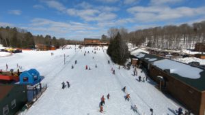 Things to do in Michigan include downhill skiing, snowboarding, snowshoeing, snowmobiling, ice fishing, sleigh rides and tubing.